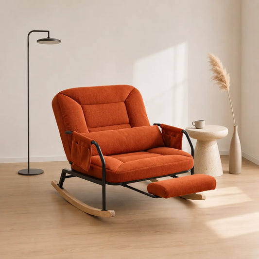 Fauteuil à bascule Siena en tissu côtelé orange terracotta avec repose-pieds intégré dans un intérieur minimaliste et chaleureux.