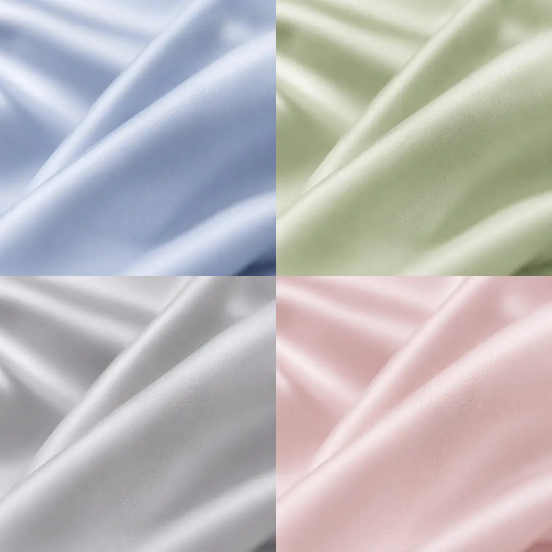 Gros plan de la texture soyeuse de la couverture rafraîchissante Marea, présentée en quatre coloris : bleu poudré, vert sauge, gris perle et rose poudré.