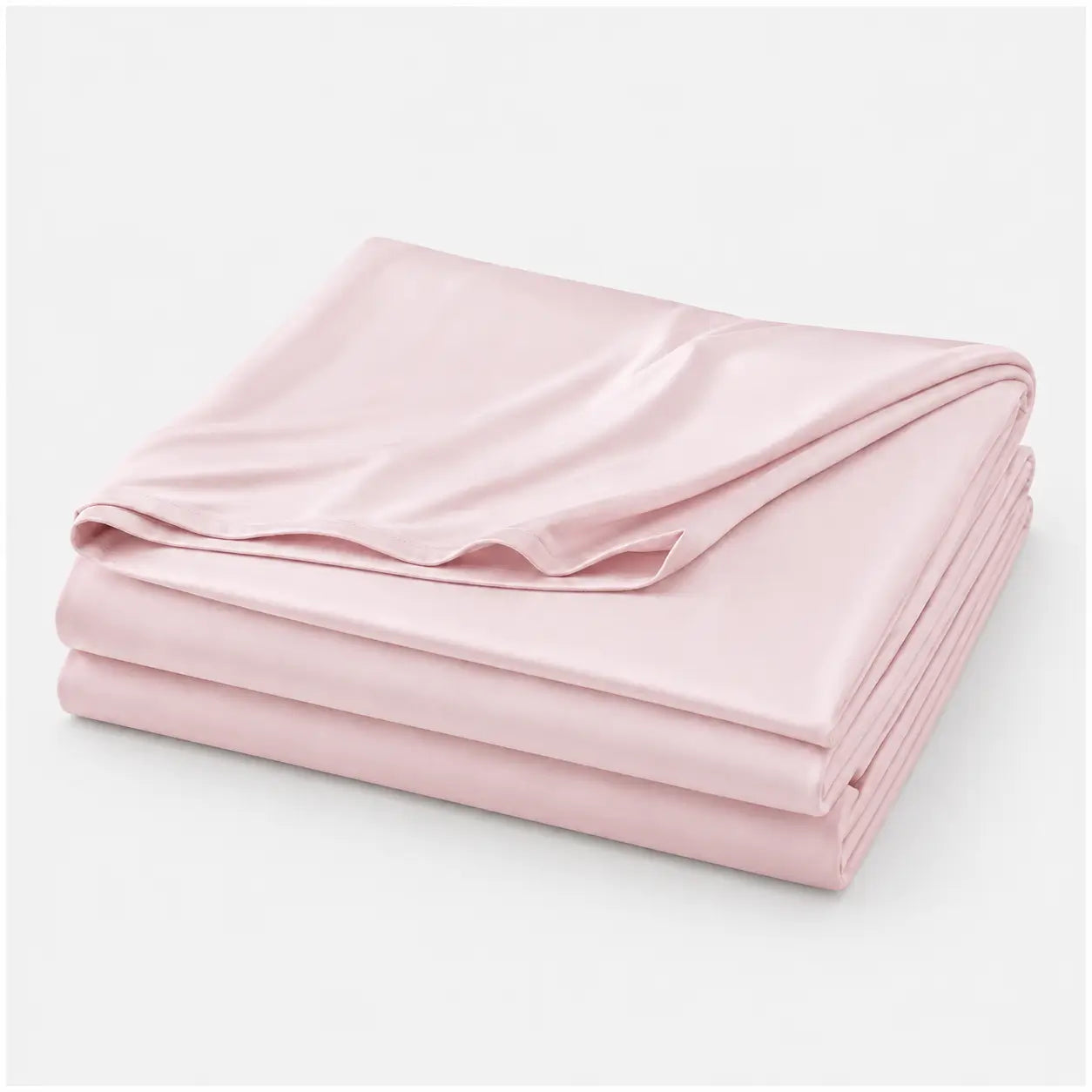 Couverture rafraîchissante Marea rose poudrée, légère et respirante, en tissu effet soie glacée, présentée pliée sur fond blanc.